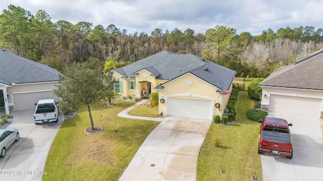 view of front of property featuring a garage and a front lawn