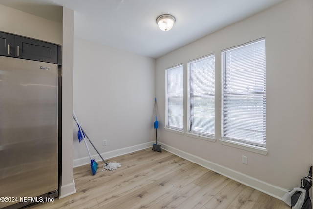 spare room with light wood-type flooring