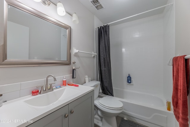 full bathroom with tasteful backsplash, vanity, shower / bath combo, and toilet