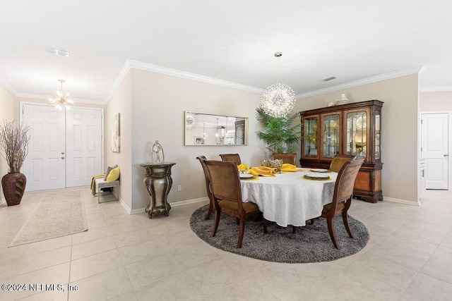 dining room with an inviting chandelier, ornamental molding, and light tile patterned flooring