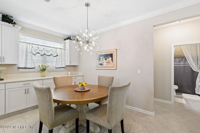 tiled dining area featuring an inviting chandelier and crown molding