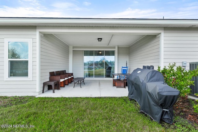 view of patio featuring a grill