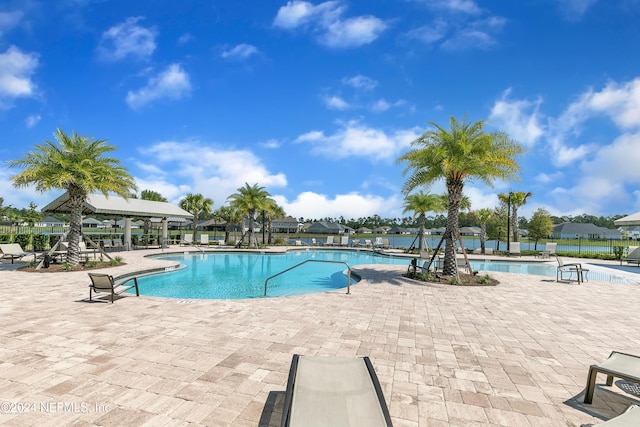 view of swimming pool featuring a patio area