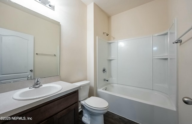 full bathroom featuring shower / washtub combination, vanity, and toilet