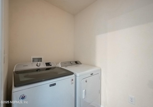 clothes washing area featuring laundry area and washer and dryer