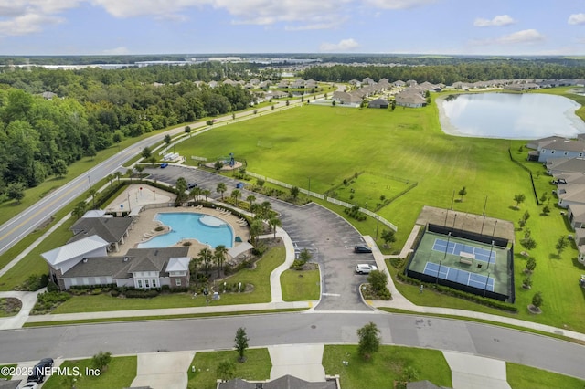 bird's eye view featuring a water view and a residential view