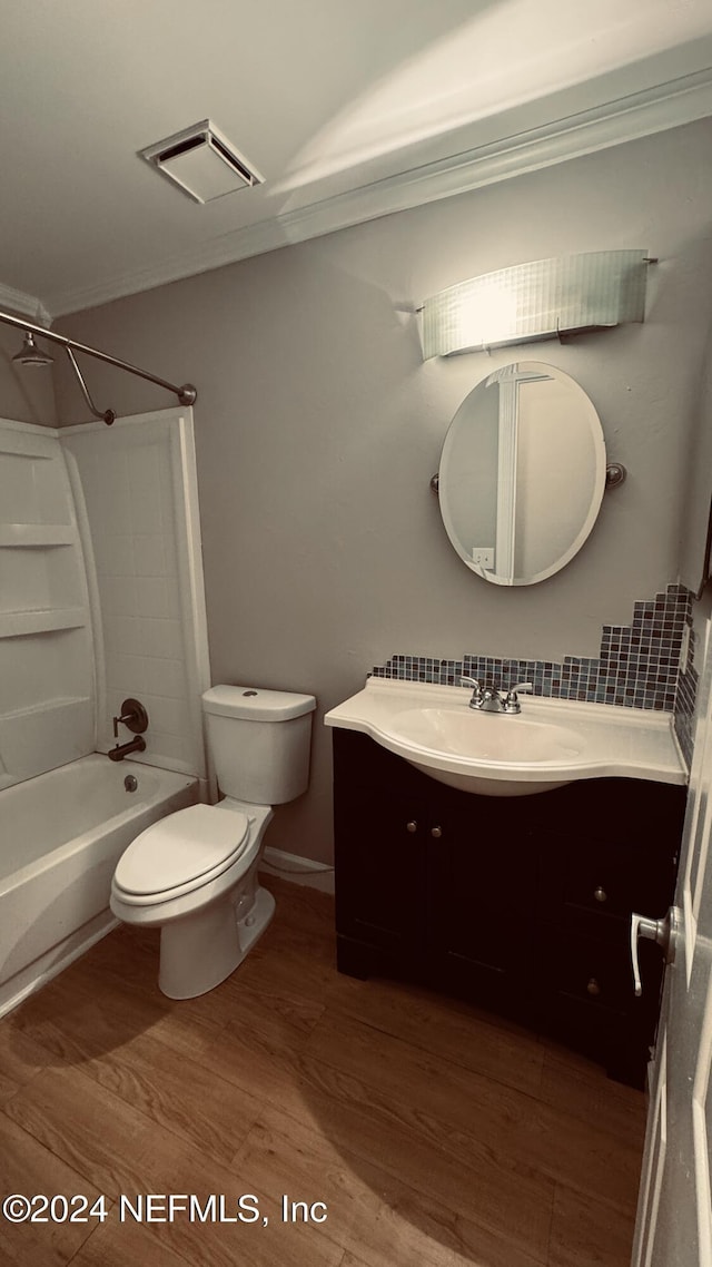 full bathroom featuring hardwood / wood-style flooring, vanity, toilet, and bathing tub / shower combination