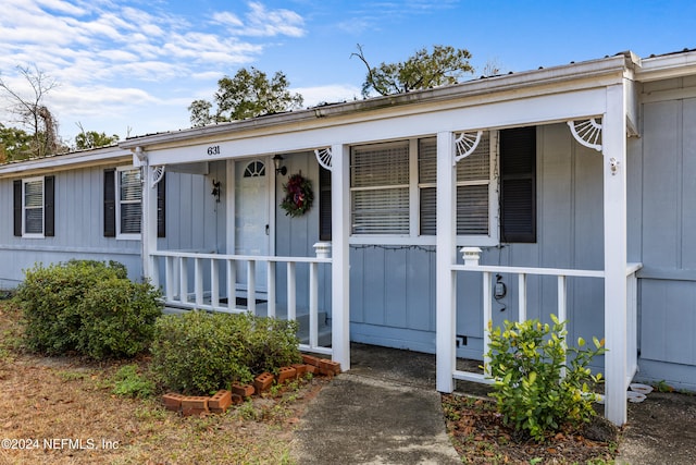 doorway to property featuring a porch