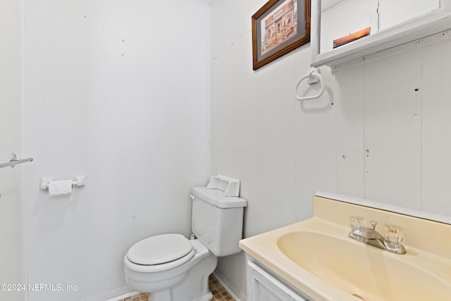 bathroom with tile patterned floors, vanity, and toilet