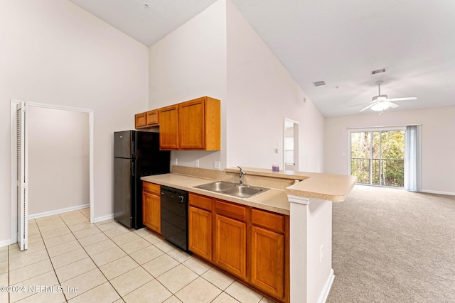 kitchen featuring ceiling fan, sink, kitchen peninsula, light carpet, and black appliances