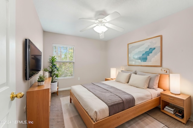 bedroom featuring ceiling fan and light colored carpet