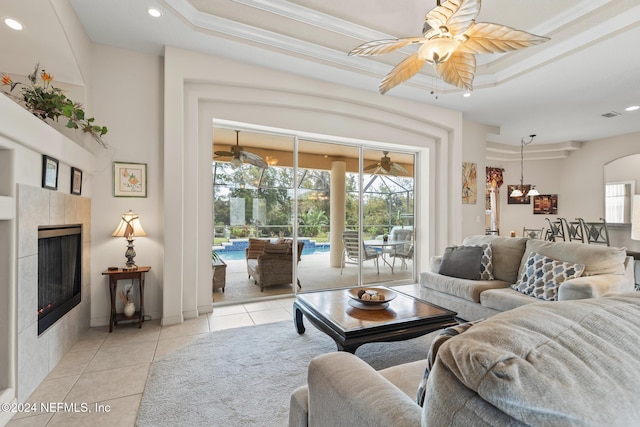 living room featuring ceiling fan, recessed lighting, light tile patterned flooring, and a tiled fireplace