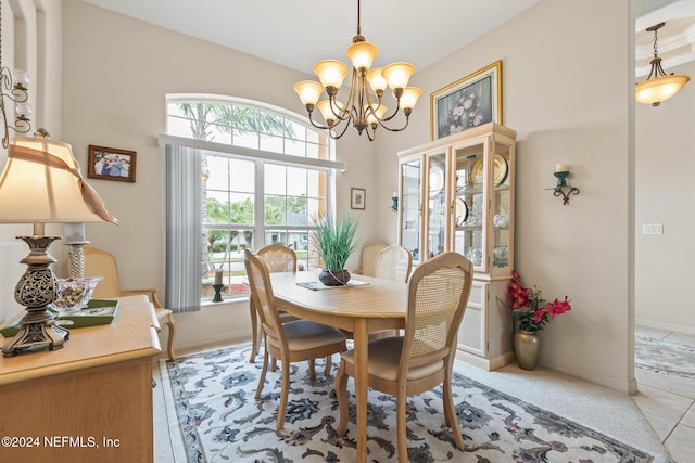 dining space with an inviting chandelier and baseboards