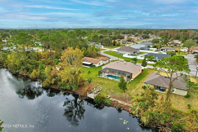 bird's eye view featuring a residential view and a water view