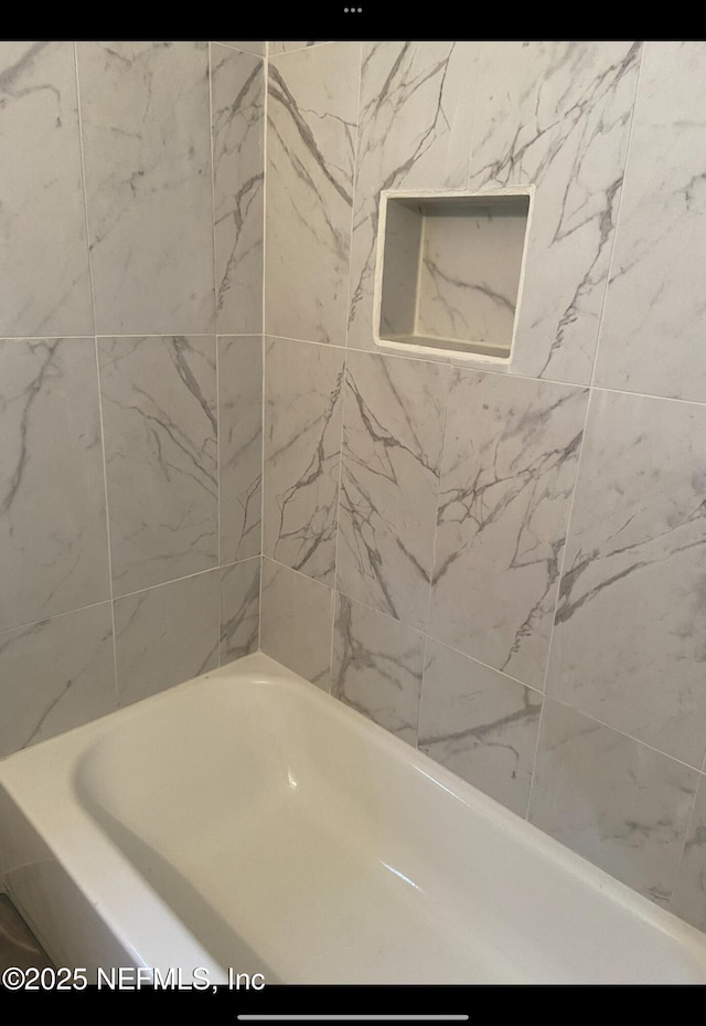 bathroom featuring a tub to relax in