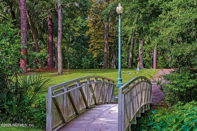 view of gate featuring a yard