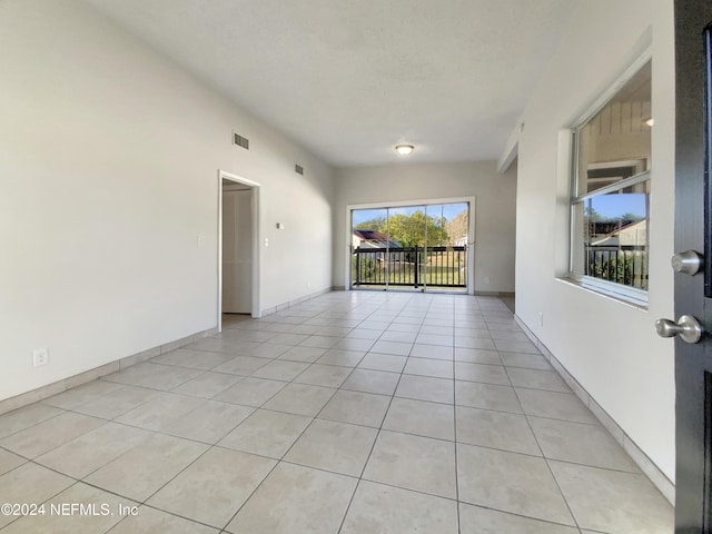 spare room with light tile patterned floors