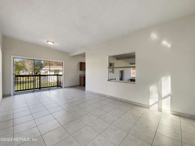 unfurnished living room with light tile patterned floors