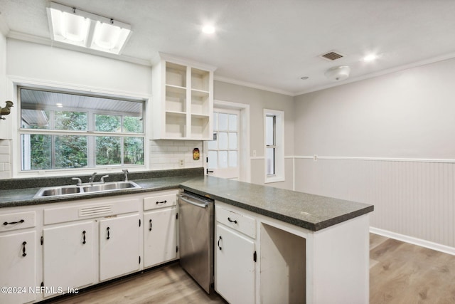 kitchen featuring kitchen peninsula, stainless steel dishwasher, sink, light hardwood / wood-style flooring, and white cabinets