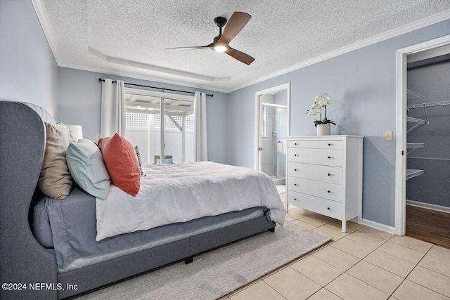 bedroom with a textured ceiling, ceiling fan, light tile patterned floors, and crown molding