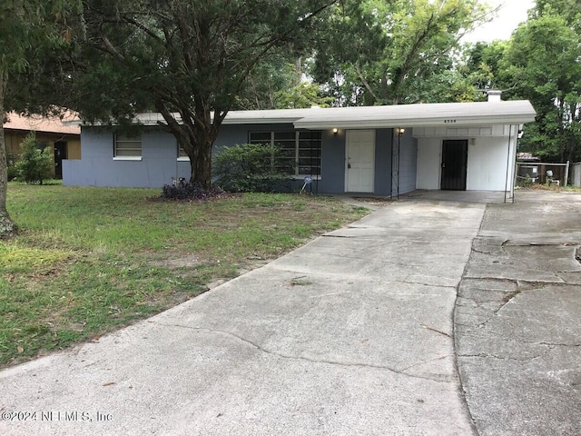 ranch-style home with a carport