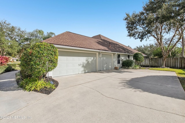 view of property exterior featuring a garage