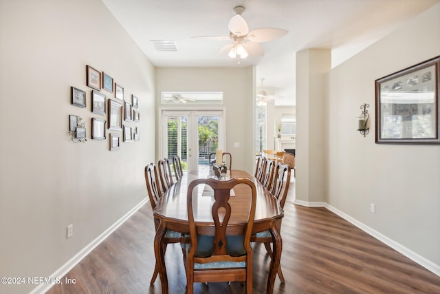 dining space with french doors, ceiling fan, and dark wood-type flooring