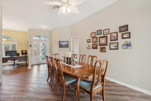 dining room featuring ceiling fan, french doors, and dark wood-type flooring