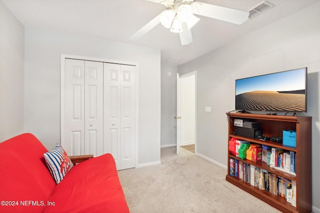 sitting room with light carpet and ceiling fan