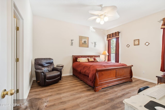 bedroom featuring ceiling fan and light hardwood / wood-style flooring