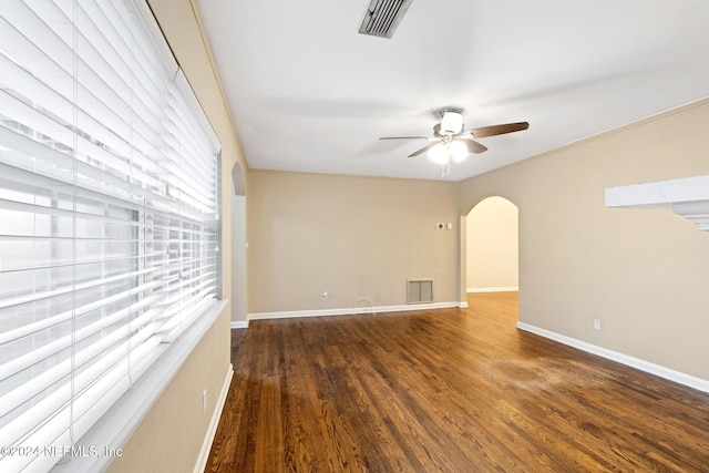 unfurnished room featuring ceiling fan and dark hardwood / wood-style flooring