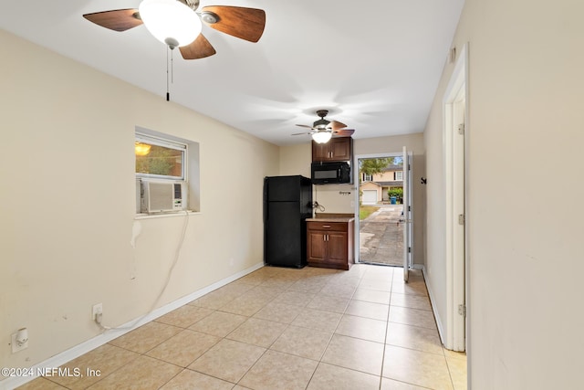 interior space featuring cooling unit and light tile patterned floors