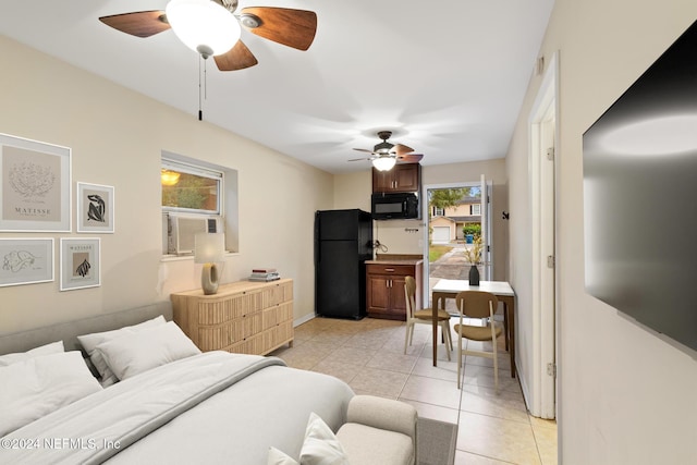 bedroom with ceiling fan, black refrigerator, cooling unit, and light tile patterned floors