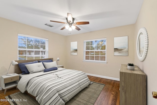 bedroom featuring ceiling fan and dark hardwood / wood-style flooring