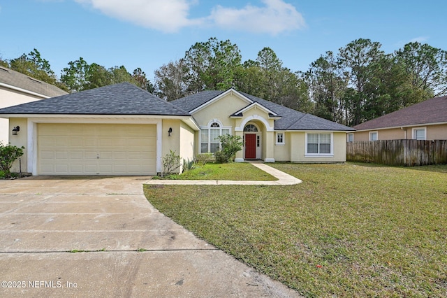 ranch-style home featuring a garage and a front yard