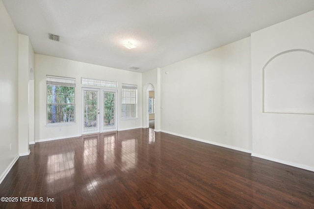 empty room featuring dark wood-type flooring