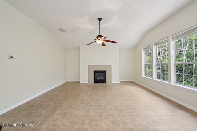 unfurnished living room with ceiling fan and lofted ceiling