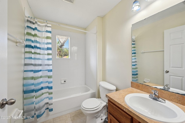 full bathroom with tile patterned flooring, vanity, toilet, and shower / bath combo with shower curtain