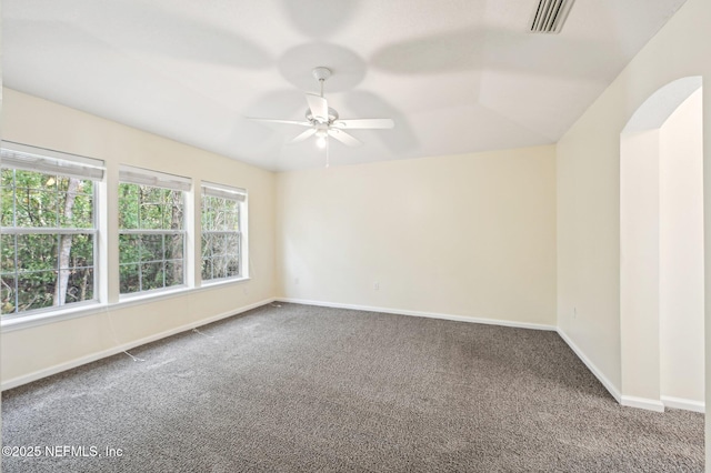 spare room featuring carpet flooring and ceiling fan