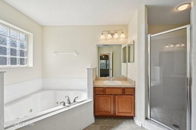 bathroom with tile patterned flooring, vanity, and plus walk in shower