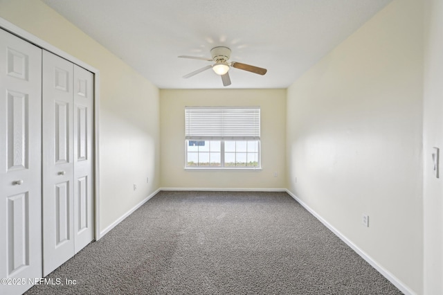 unfurnished bedroom with carpet flooring, a closet, and ceiling fan