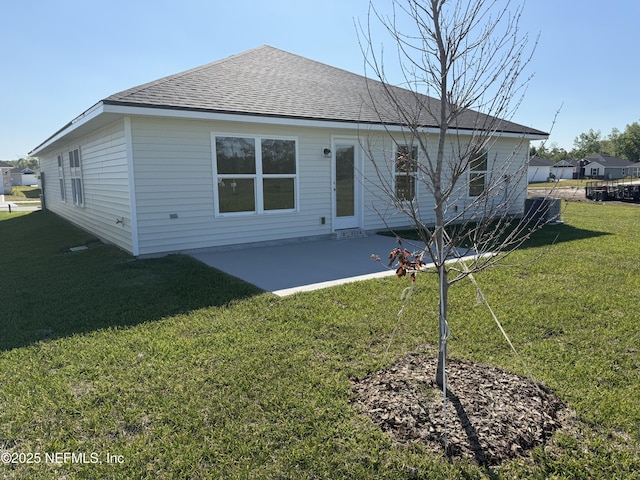 8195 Elsdon St, Jacksonville, FL 32219 - back of property with a patio, a lawn, and roof with shingles