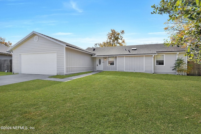 ranch-style home with a garage and a front yard