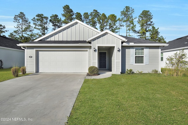 view of front of home featuring a garage and a front yard