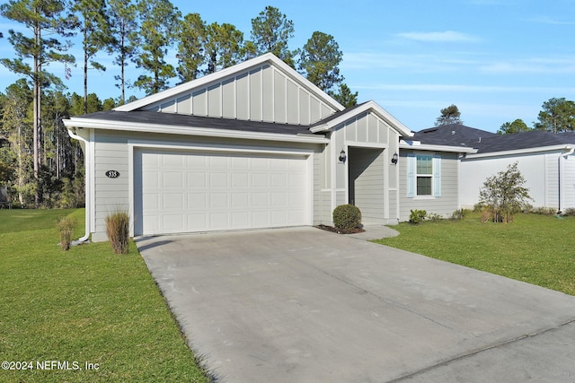 ranch-style home with a front yard and a garage