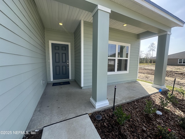 doorway to property with a porch