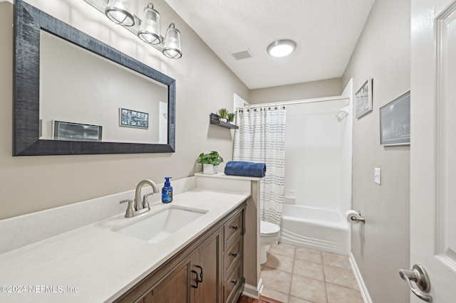 full bathroom with vanity, tile patterned floors, toilet, a textured ceiling, and shower / tub combo with curtain