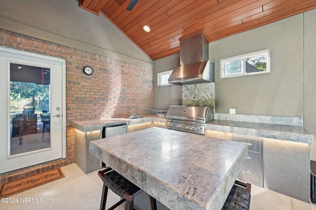 kitchen with sink, brick wall, ventilation hood, vaulted ceiling, and wood ceiling