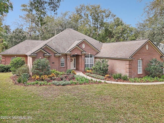 view of front of home with a front lawn