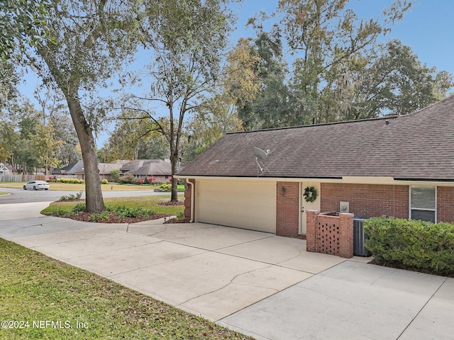 view of property exterior with a garage